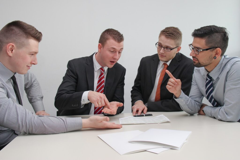 Men discussing means of understanding the Canadian job market