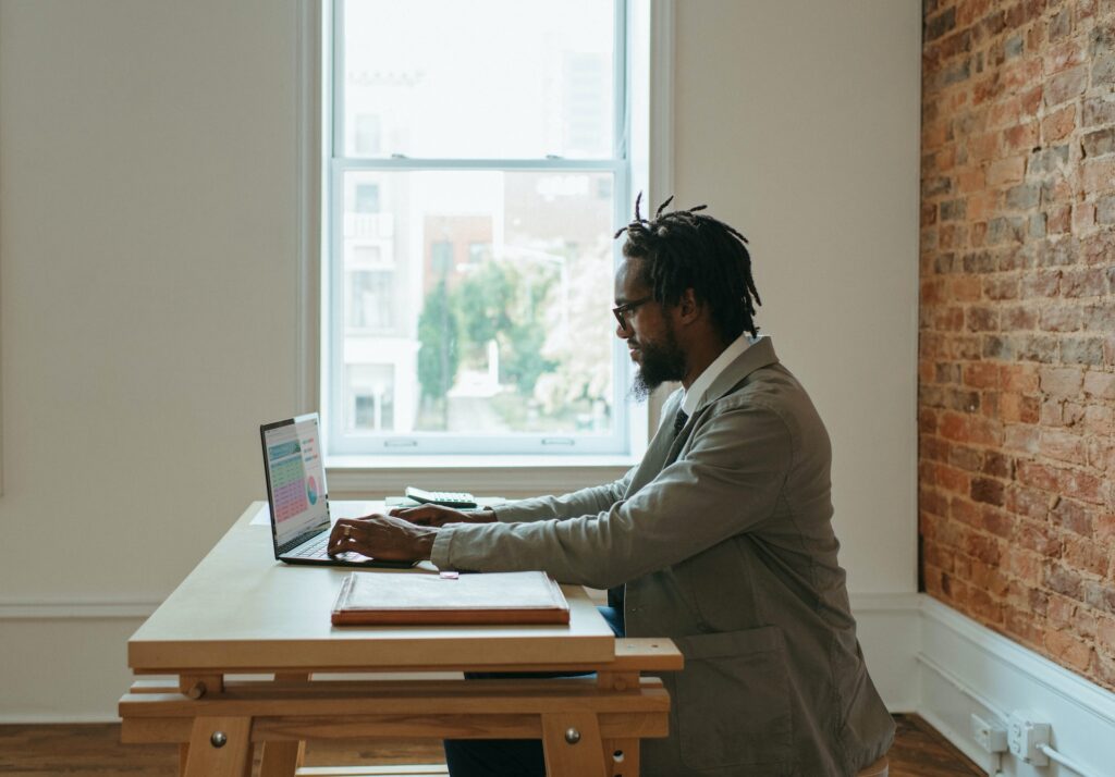 Guy sitting and doing remote job in the UK
