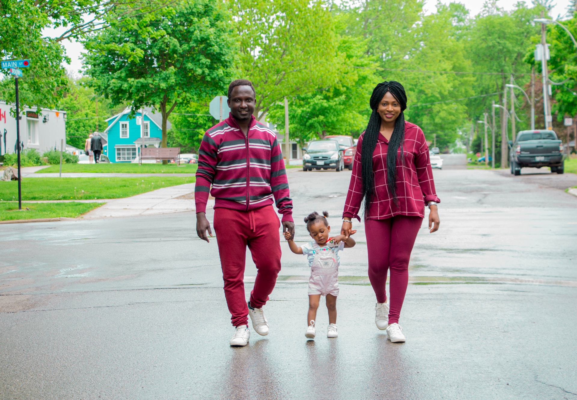 family happily walking the street after getting the answer to an important question: What Settlement Services are Available to Immigrants in the UK?